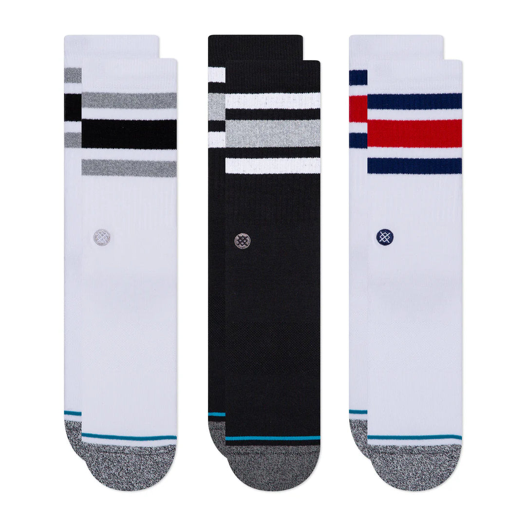 Three pairs of Stance socks with different color  stripes on a white background